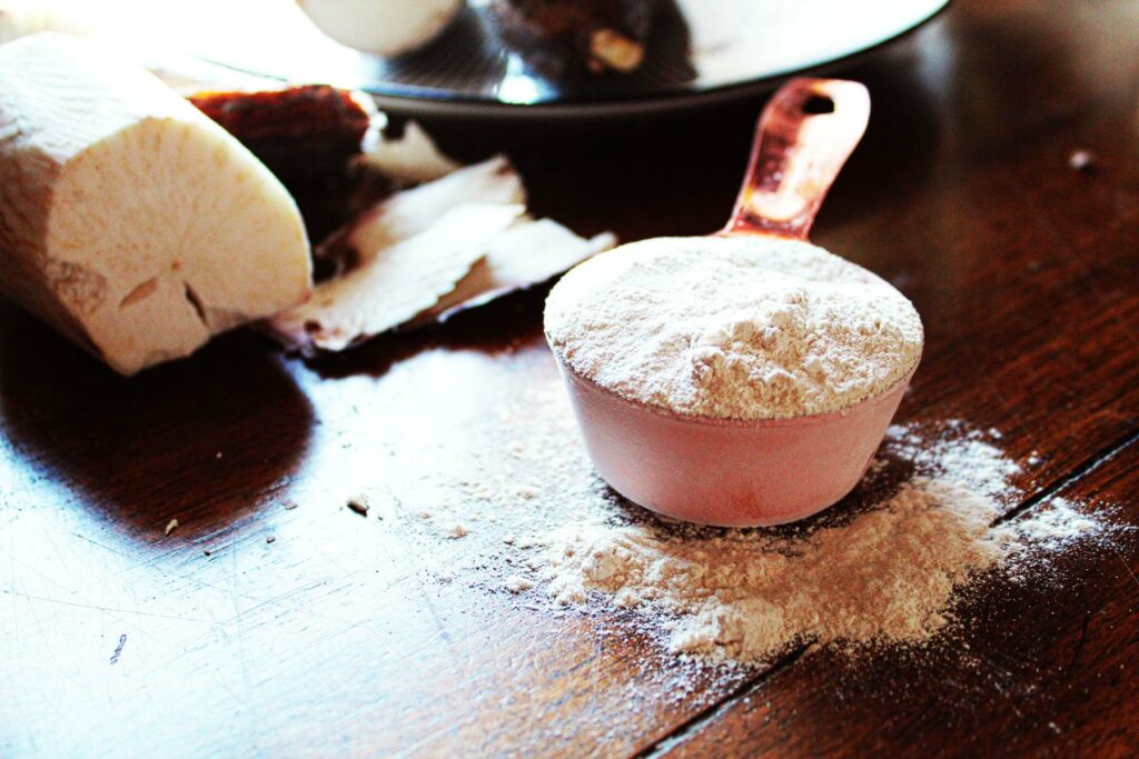 organic tapioca starch next to a cassava root