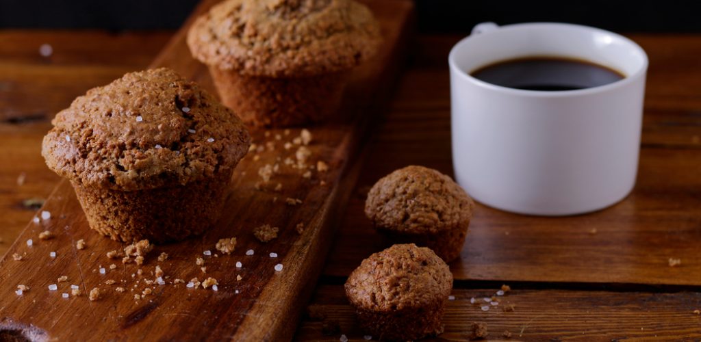 Freshly,Baked,Bran,Muffins,On,A,Wooden,Board,With,A